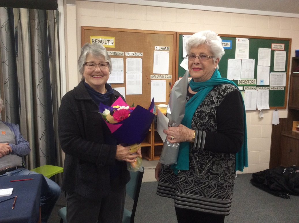 lynette and lesley: Lynette GM receives her bouquet and congratulations from Lesley Quilty GM at Monday Night bridge in Matamata